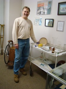 Dave Scott, owner, stands with medical supplies in their museum.
