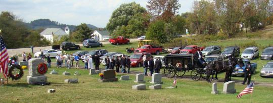 Funeral Procession arrives at Village View Cemetery.