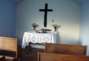 Cross of Burned Timbers at the altar of Royer Chapel
