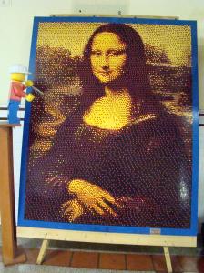 Lego Mona Lisa with Lego artist giving a final touch.