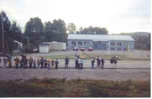 School children wave to the Agawa Canyon Train.