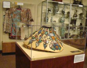 Chinese royalty collar with silk kimona and pottery in the background