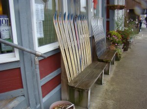 Benches with ski backs line the street.