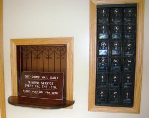 Unusual postal hours on sign