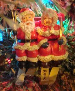Santa and Mrs. Claus ride the ski lift at Aspen, CO.