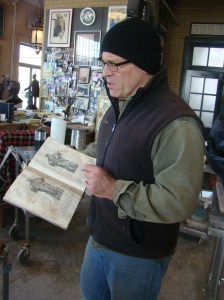 Alan with his Sculptor's Bible, an old anatomy book.