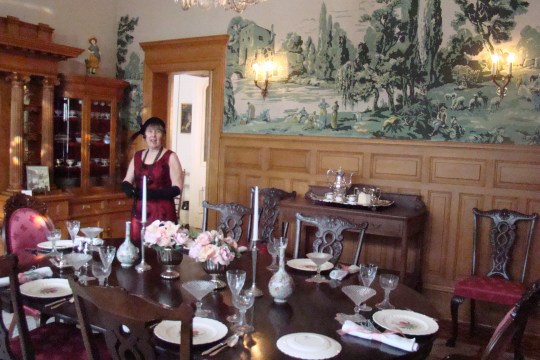 Guide, Shirley, describes the elegant dining room with silk screen wall covering.