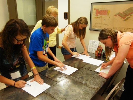 Students enjoy using the etching plates.