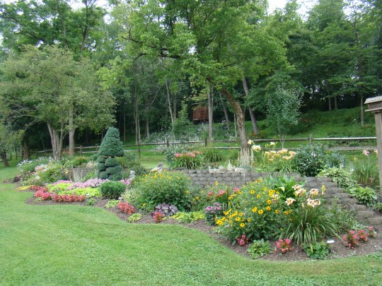 Beautiful flowers brighten this country home.