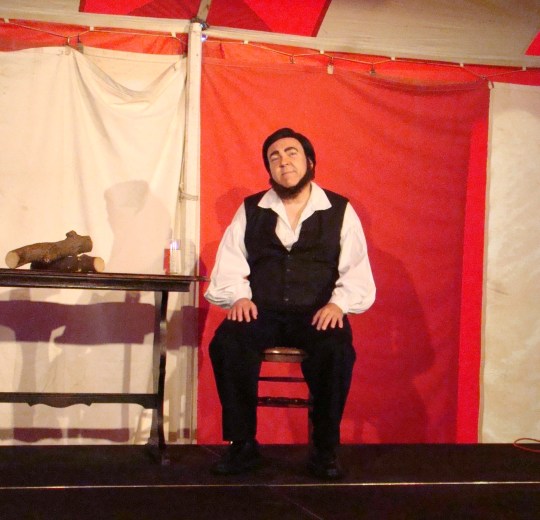 Thoreau relaxes on stage.