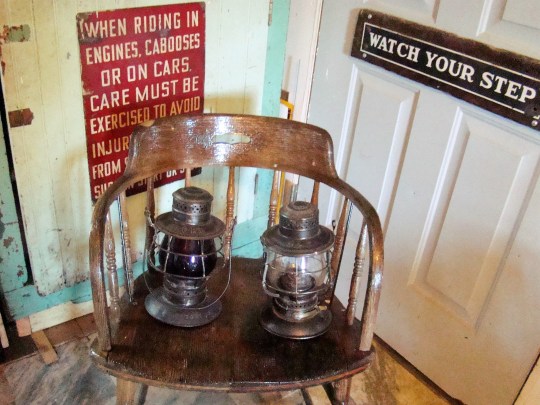 This original chair from a B&O office holds two lanterns.