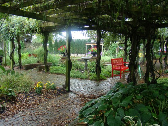Relax under the arbor in the peaceful gardens.