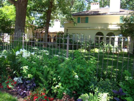 mission-oaks-home-surrounded-by-flowers