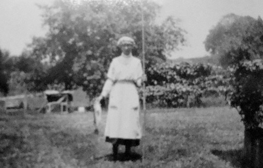 Emma with fish from their farm pond